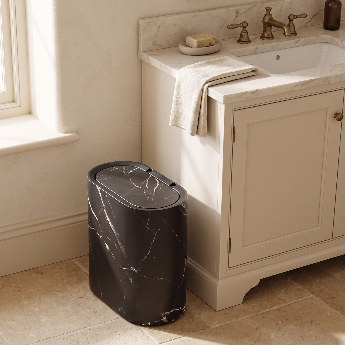 Carrera trash can beside a bathroom vanity